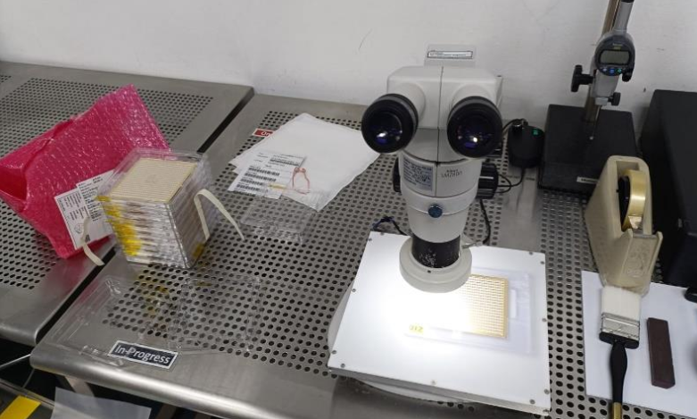 Quality inspection workstation using a microscope to examine semiconductor components for defects and conformity