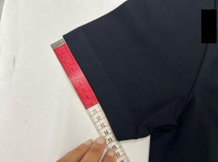 Food quality inspection measuring the diameter of an orange using a digital caliper to verify size and caliber