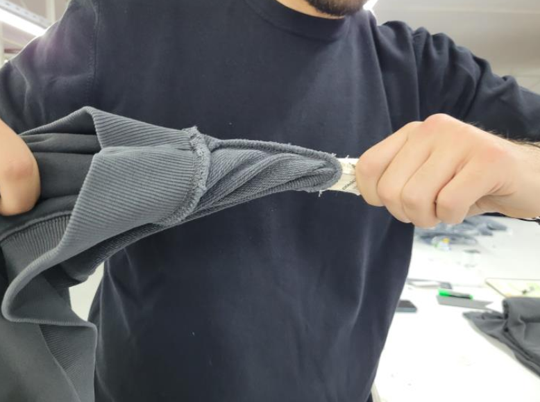 Food quality inspection measuring the diameter of an orange using a digital caliper to verify size and caliber
